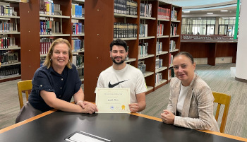 From left:  Kara Jones (University Librarian), Laith Nsiri (Library Student Assistant) &amp; Alanna Ross (Associate University Librarian – Public Services